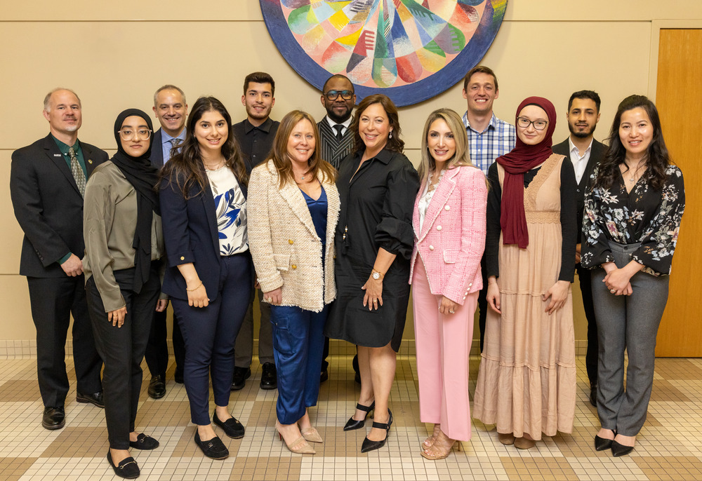 students in the leadership development program standing in a line and smiling