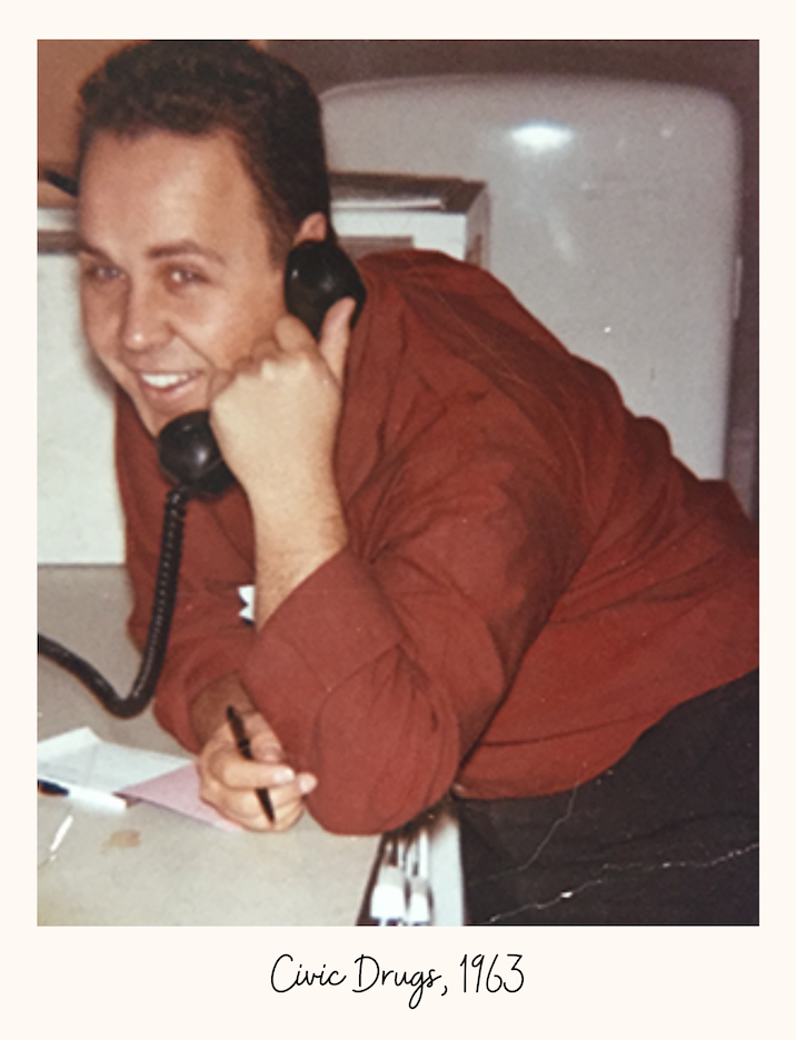 Eugene Applebaum on the phone at his pharmacy
